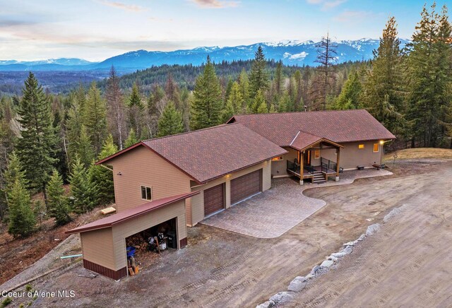 422 Lightning Peak Rd, Sandpoint, ID 83864 - aerial view of property and surrounding area featuring a heavily wooded area and a mountainous background