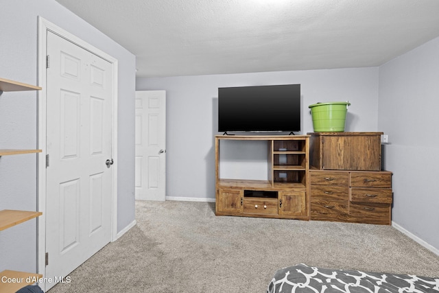 bedroom featuring carpet flooring and baseboards