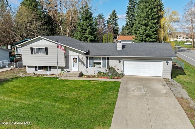 split level home featuring an attached garage and driveway