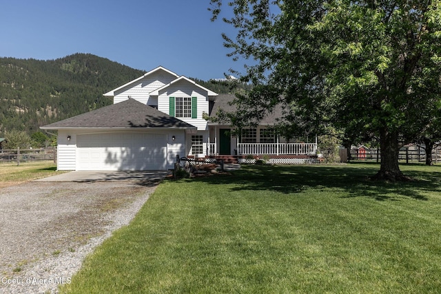 5904 N 15th St, Dalton Gardens, ID 83815 - view of front of property with driveway, an attached garage, roof with shingles, and a deck with mountain view