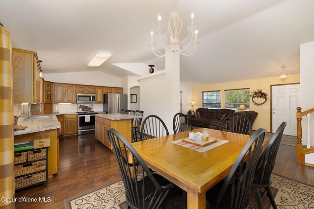 5904 N 15th St, Dalton Gardens, ID 83815 - dining area with vaulted ceiling, dark wood-style flooring, and a chandelier