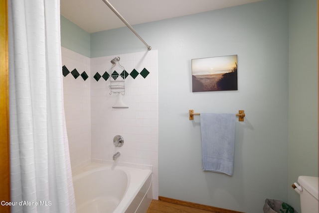 5904 N 15th St, Dalton Gardens, ID 83815 - bathroom with shower / tub combo, toilet, and wood finished floors