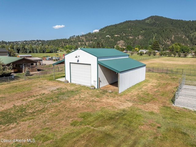 5904 N 15th St, Dalton Gardens, ID 83815 - view of pole building with a mountain view, a wooded view, and driveway