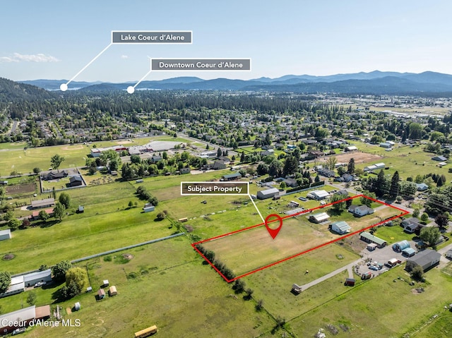 5904 N 15th St, Dalton Gardens, ID 83815 - aerial view of property and surrounding area with a mountain backdrop and property boundaries highlighted