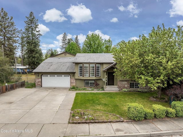405 W 22nd Ave, Post Falls, ID 83854 - view of front of property featuring brick siding, concrete driveway, an attached garage, and roof with shingles