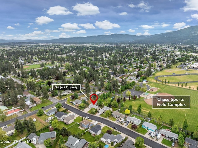 405 W 22nd Ave, Post Falls, ID 83854 - aerial view of property and surrounding area featuring a mountain backdrop and nearby suburban area