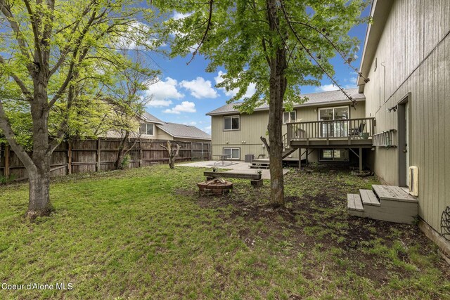 405 W 22nd Ave, Post Falls, ID 83854 - view of yard with an outdoor fire pit, a wooden deck, and stairs