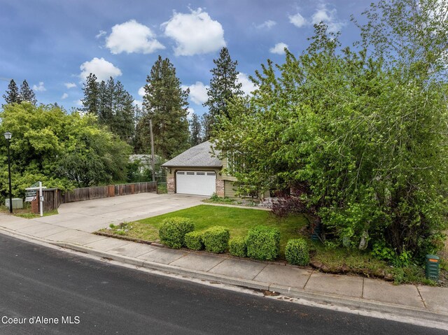 405 W 22nd Ave, Post Falls, ID 83854 - obstructed view of property with concrete driveway and brick siding