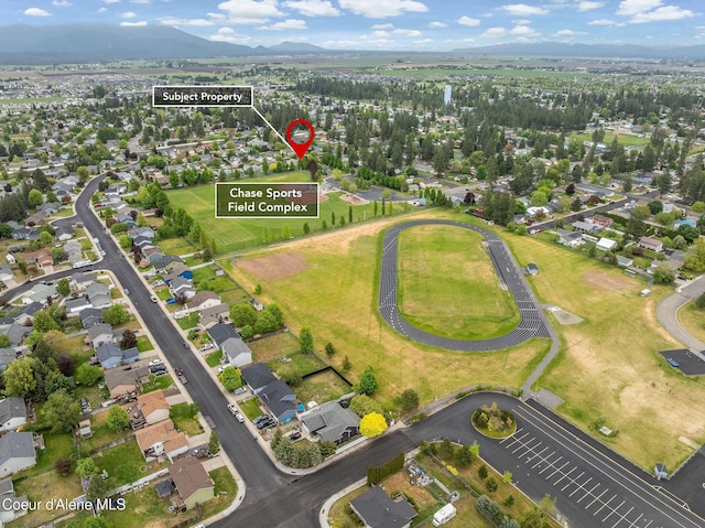 405 W 22nd Ave, Post Falls, ID 83854 - aerial view of property's location featuring a mountain backdrop and nearby suburban area