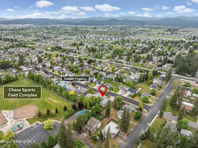 405 W 22nd Ave, Post Falls, ID 83854 - aerial overview of property's location with mountains