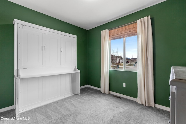 5441 W Gumwood Cir, Post Falls, ID 83854 - unfurnished bedroom with baseboards, visible vents, and carpet
