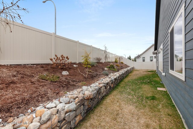 5441 W Gumwood Cir, Post Falls, ID 83854 - view of yard featuring a fenced backyard