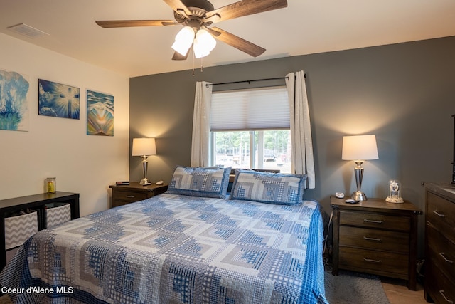 bedroom featuring ceiling fan and visible vents