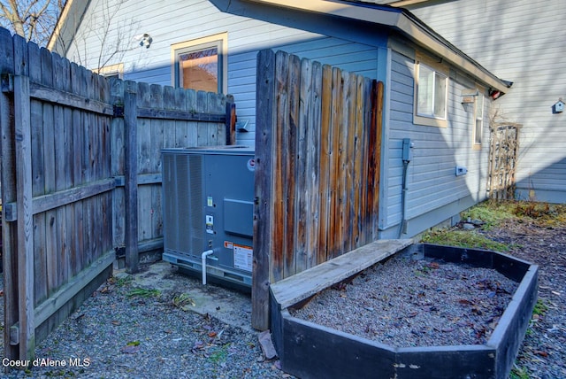 723 Pine St, Sandpoint, ID 83864 - view of outdoor structure with central AC unit and fence