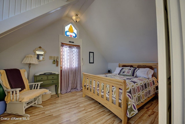 723 Pine St, Sandpoint, ID 83864 - bedroom with lofted ceiling and wood finished floors