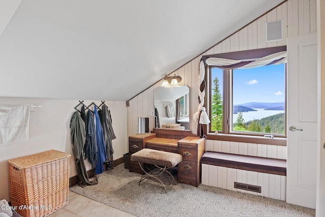 3467 E Sunset Dr, Harrison, ID 83833 - home office with vaulted ceiling, wood walls, and light tile patterned flooring