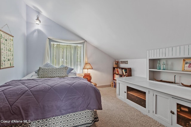 3467 E Sunset Dr, Harrison, ID 83833 - bedroom with vaulted ceiling and light carpet