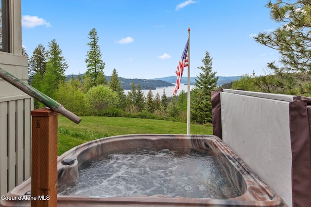 3467 E Sunset Dr, Harrison, ID 83833 - exterior space with mountains and a hot tub