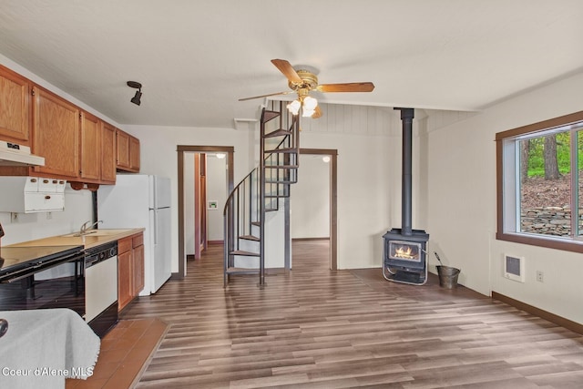 3467 E Sunset Dr, Harrison, ID 83833 - kitchen with black / electric stove, dishwasher, a ceiling fan, and wood finished floors