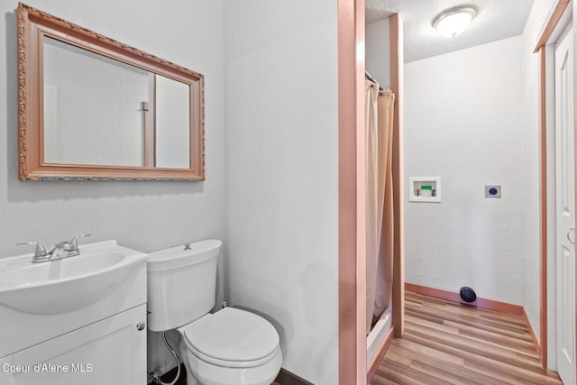 3467 E Sunset Dr, Harrison, ID 83833 - full bathroom featuring vanity, wood finished floors, and a shower stall