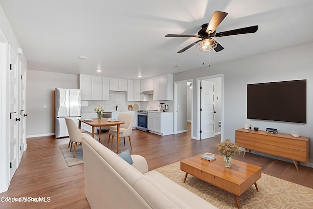 1313 N Division Ave Unit B, Sandpoint, ID 83864 - living area with ceiling fan, light wood-type flooring, and recessed lighting