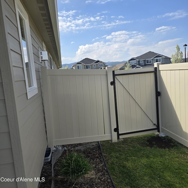 view of gate featuring fence