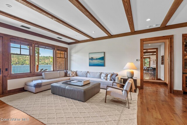 4669 S Arrow Point Dr # 210, Harrison, ID 83833 - living area featuring light wood-style flooring, beam ceiling, and baseboards