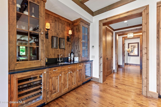 4669 S Arrow Point Dr # 210, Harrison, ID 83833 - bar featuring a sink, indoor wet bar, light wood-style floors, and wine cooler