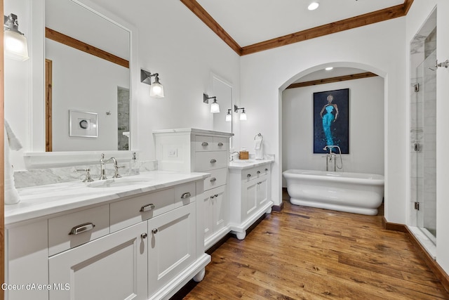 4669 S Arrow Point Dr # 210, Harrison, ID 83833 - bathroom featuring a shower stall, crown molding, wood finished floors, and vanity