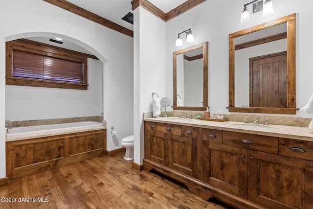 4669 S Arrow Point Dr # 210, Harrison, ID 83833 - bathroom featuring a bath, ornamental molding, toilet, wood finished floors, and a sink