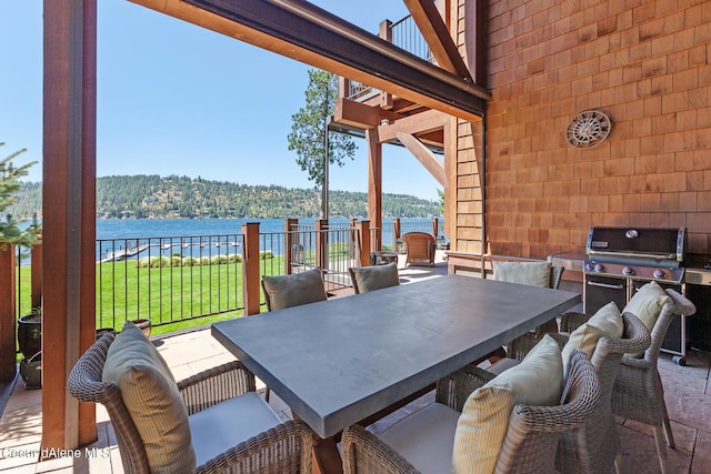 4669 S Arrow Point Dr # 210, Harrison, ID 83833 - view of patio featuring a water view and outdoor dining space
