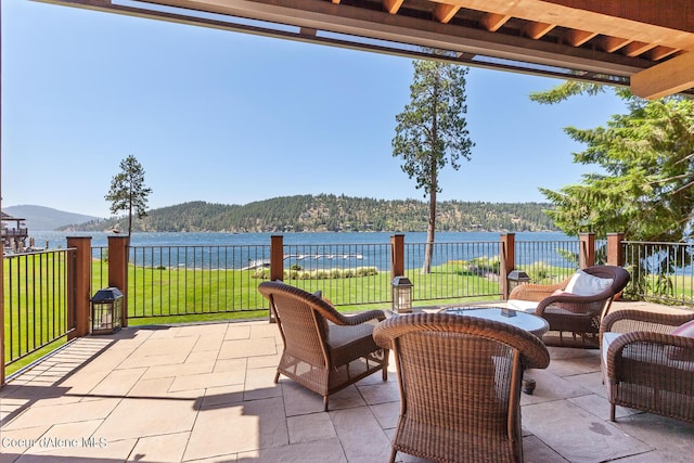 4669 S Arrow Point Dr # 210, Harrison, ID 83833 - view of patio / terrace featuring a water view and a forest view