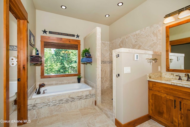 full bath featuring toilet, recessed lighting, vanity, a garden tub, and a walk in shower