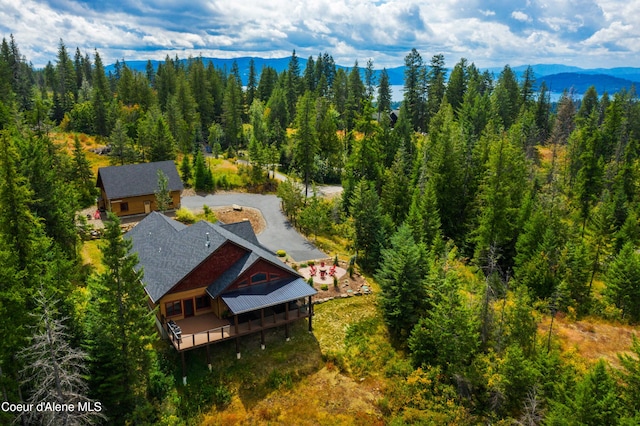 bird's eye view with a mountain view and a view of trees
