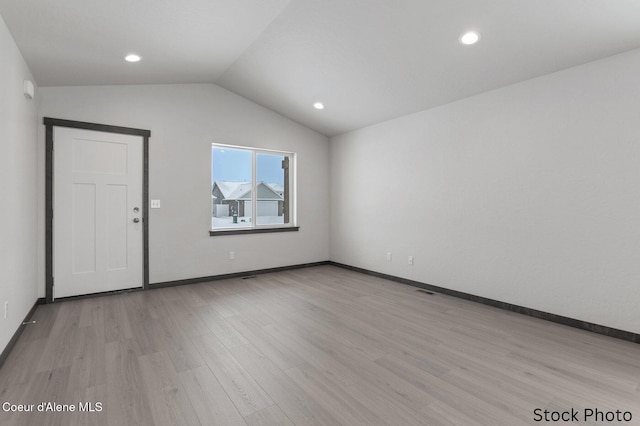 11669 N Railway Ave, Rathdrum, ID 83858 - unfurnished room featuring light wood-style flooring, vaulted ceiling, baseboards, and recessed lighting