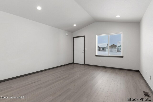 11669 N Railway Ave, Rathdrum, ID 83858 - unfurnished room with lofted ceiling, light wood-style flooring, baseboards, and recessed lighting