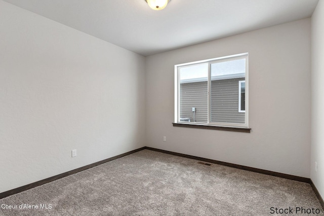 11669 N Railway Ave, Rathdrum, ID 83858 - unfurnished room featuring carpet and baseboards