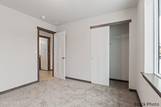11669 N Railway Ave, Rathdrum, ID 83858 - unfurnished bedroom featuring carpet floors, baseboards, and a closet