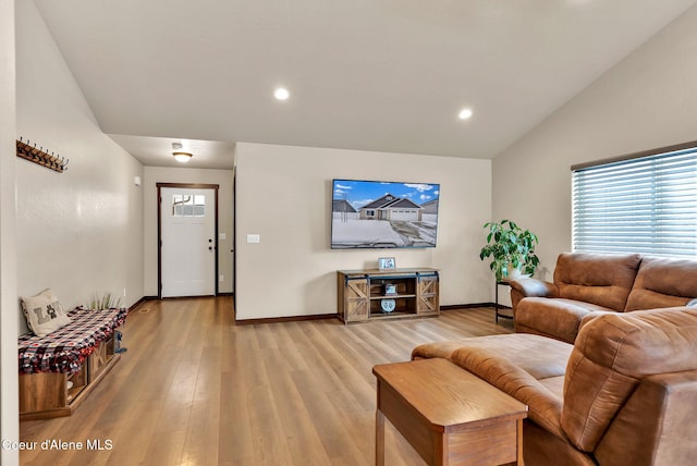 12379 N Cavanaugh Dr, Rathdrum, ID 83858 - living area featuring lofted ceiling, healthy amount of natural light, baseboards, light wood-style flooring, and recessed lighting