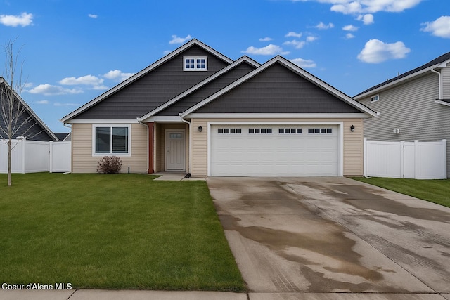 12379 N Cavanaugh Dr, Rathdrum, ID 83858 - view of front of house featuring concrete driveway and an attached garage