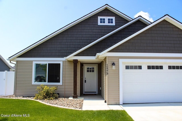 12379 N Cavanaugh Dr, Rathdrum, ID 83858 - view of front of home with a garage and driveway