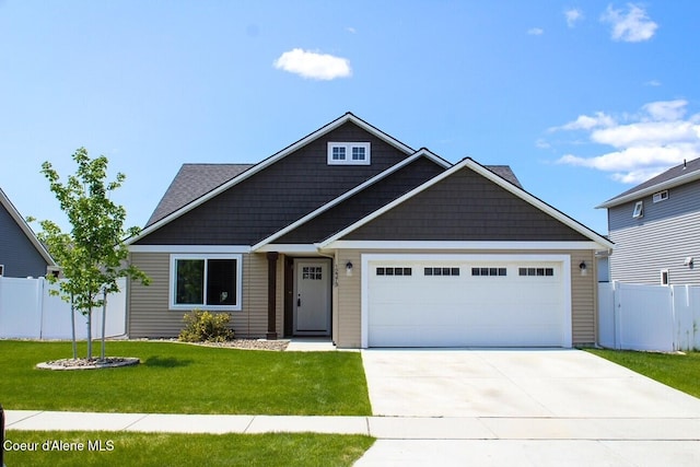 12379 N Cavanaugh Dr, Rathdrum, ID 83858 - craftsman house featuring an attached garage and concrete driveway