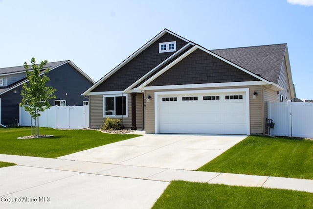 12379 N Cavanaugh Dr, Rathdrum, ID 83858 - view of front of house featuring a garage and concrete driveway
