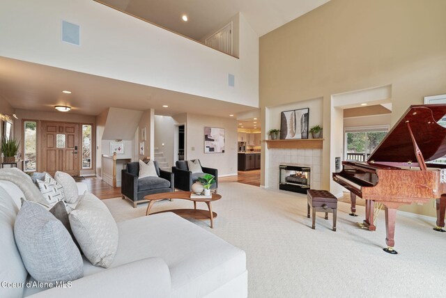 living area featuring baseboards, a fireplace, and visible vents