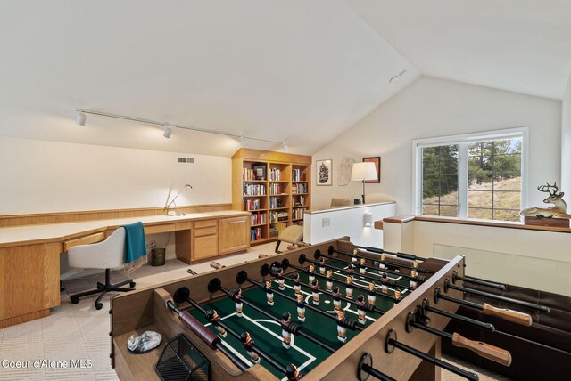 rec room with light colored carpet, lofted ceiling, visible vents, and rail lighting