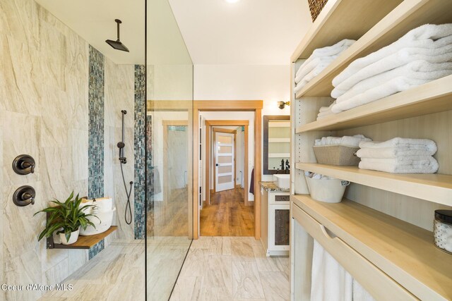 bathroom with vanity and walk in shower