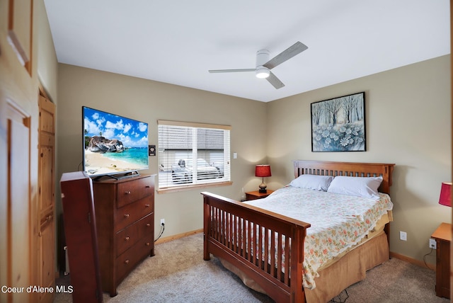 bedroom with carpet flooring, a ceiling fan, and baseboards