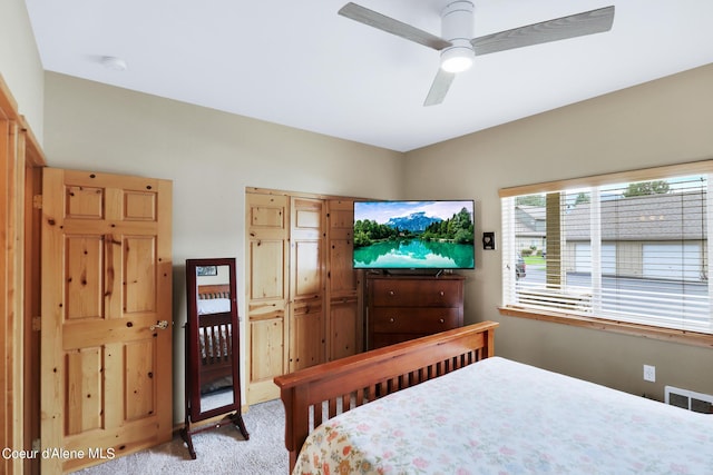 bedroom featuring visible vents, ceiling fan, and carpet flooring