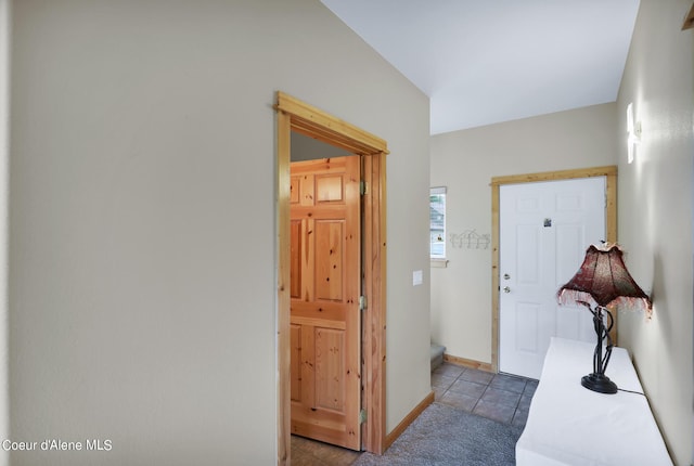 entrance foyer with baseboards and tile patterned floors