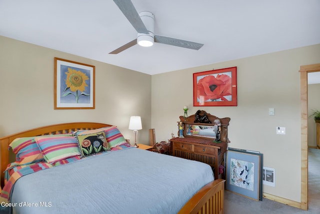 carpeted bedroom featuring baseboards and ceiling fan